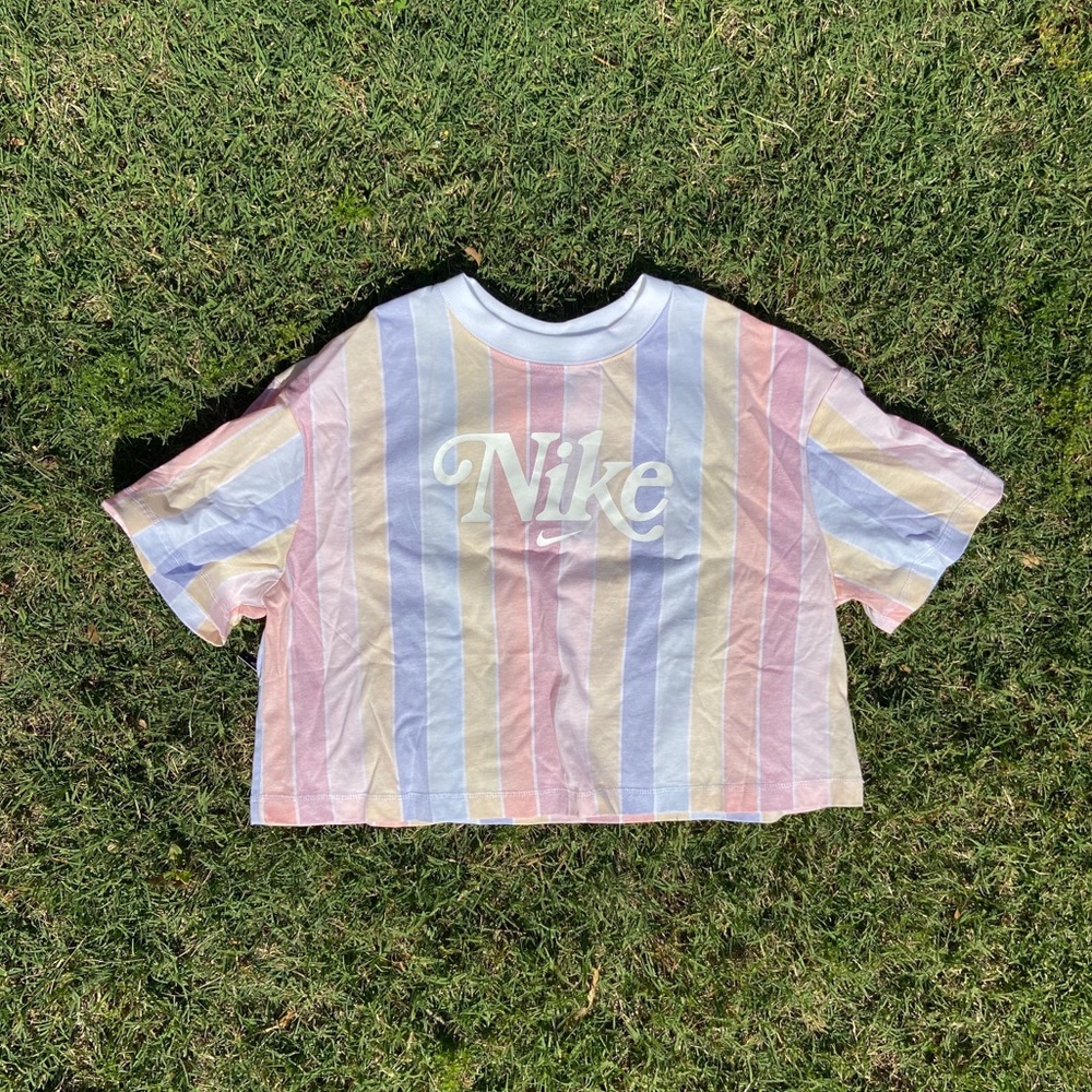 Pastel striped crop top with large Nike logo